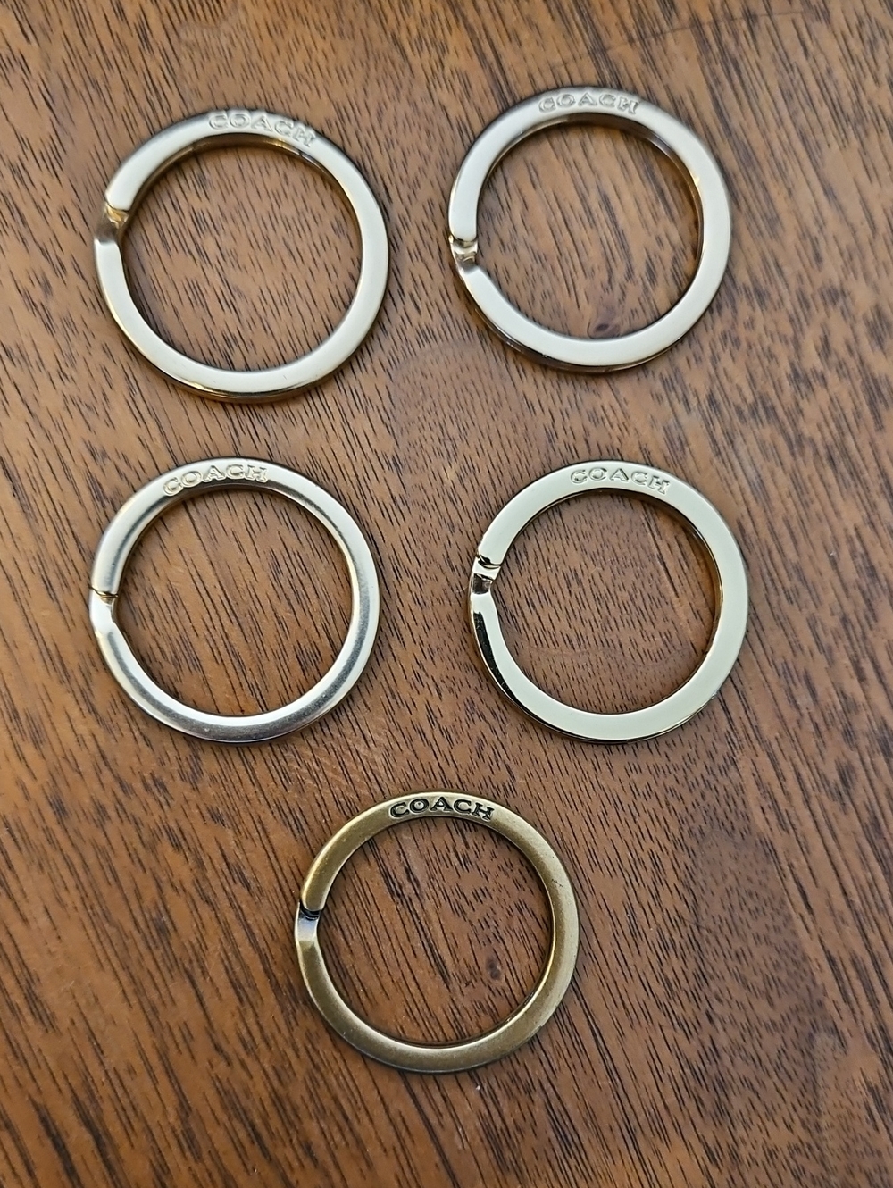 COACH Gold and Brass Key Rings Set